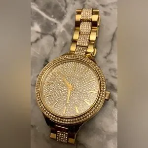 Michael Kors Style #MK3632 Watch
Size: 38mm 
Water Resistance: up to 50 meters Michael Kors Crystal Gold Tone Stainless Steel Ladies Watch  main image 3